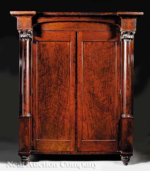 Appraisal: An American Classical Carved Mahogany Wardrobe c the molded and