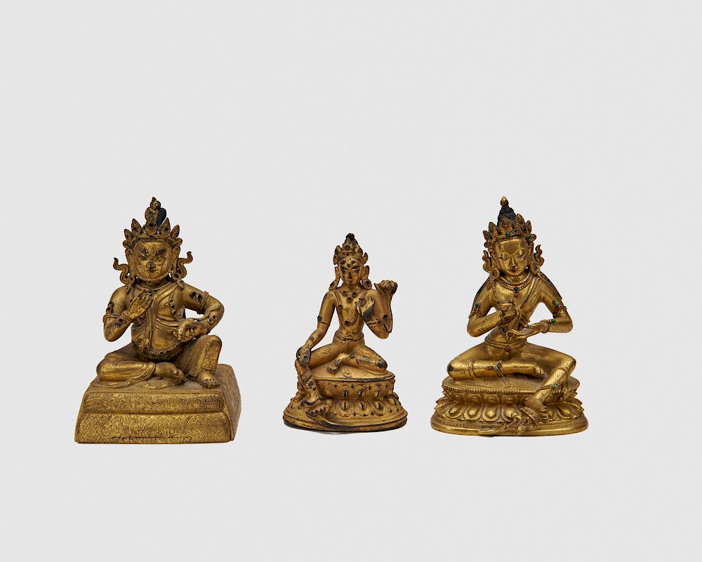 Appraisal: Three Gilt Bronze Figures of Seated Deities Three Gilt Bronze