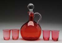 Appraisal: CRANBERRY GLASS DECANTER AND FOUR GLASSES Cranberry glass decanter with