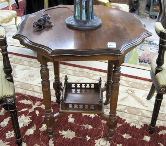 Appraisal: A VICTORIAN WALNUT LAMP TABLE English c having an octagonal