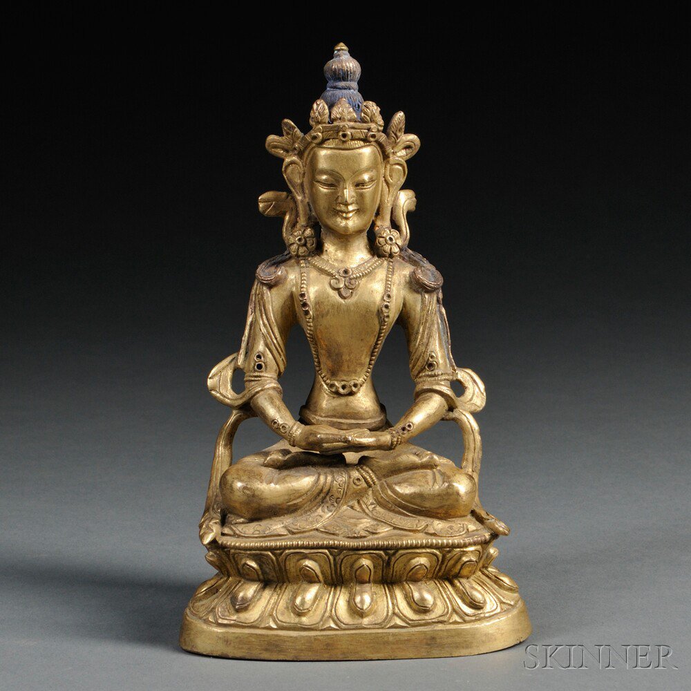 Appraisal: Gilt-bronze Figure of Avalokiteshvara Sino-Tibet the bodhisattva depicted seated in