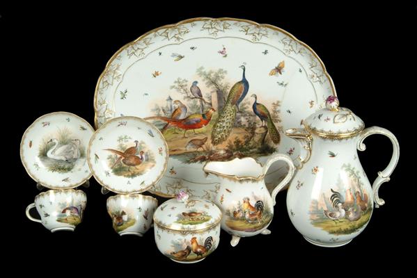 Appraisal: A Meissen outside decorated tete-a-tete coffee service painted with vignettes