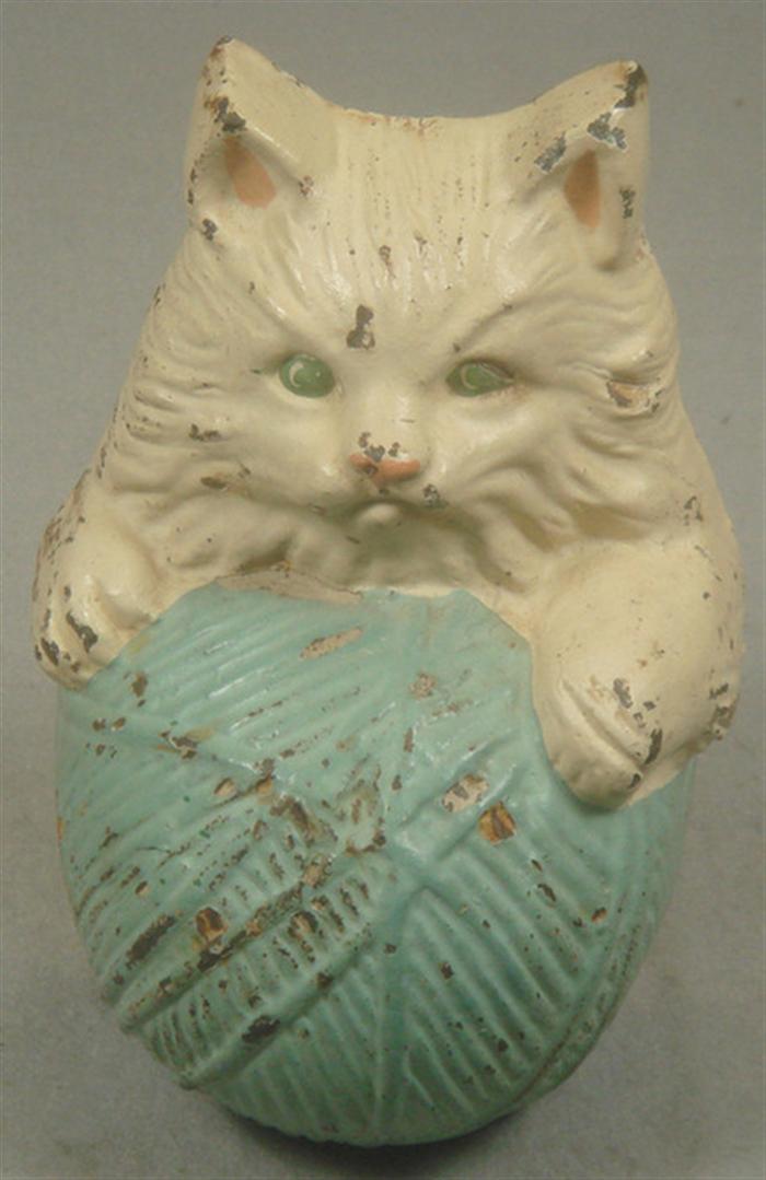 Appraisal: Cast iron doorstop free standing white kitten with blue ball