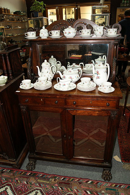 Appraisal: A LATE REGENCY ROSEWOOD CHIFFONIER having a raised back with