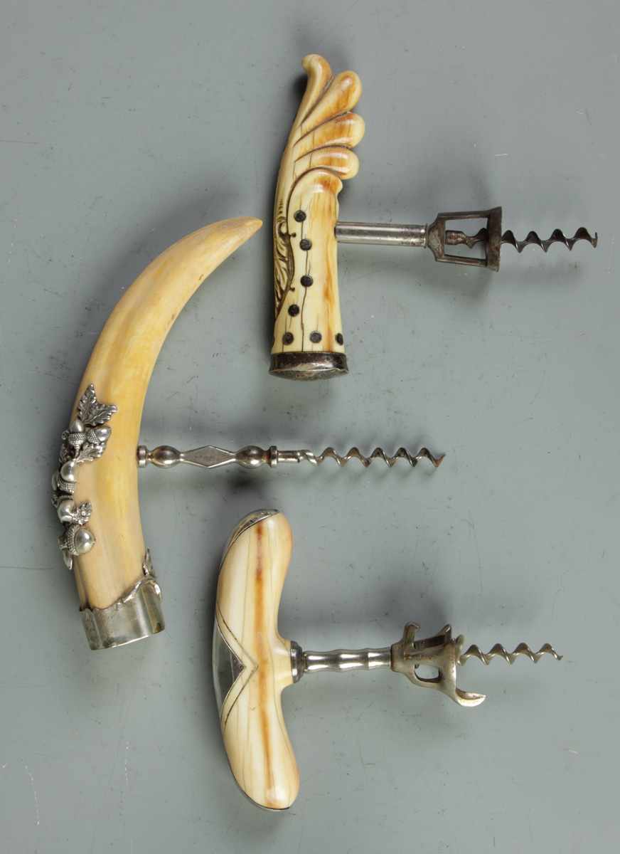 Appraisal: Bone Silver Mounted Cork Screws Bone Silver Mounted Cork Screws