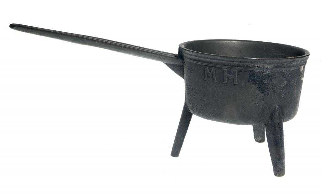 Appraisal: AN ENGLISH LEAD-BRONZE SKILLET the cast handle moulded with two