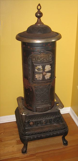 Appraisal: PLYMOUTH CAST IRON WOOD BURNING PARLOR STOVE Comes apart into