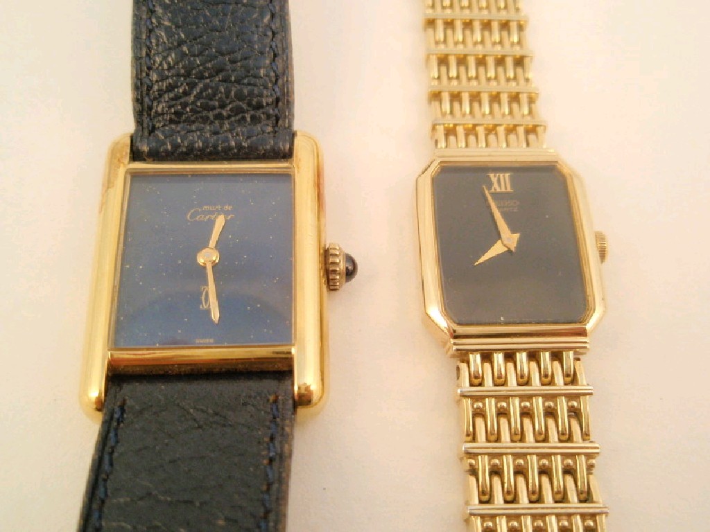 Appraisal: A Must de Cartier ladies gold plated wristwatch on navy