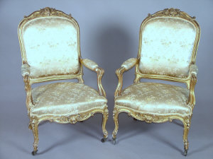 Appraisal: A pair of French carved giltwood framed fauteuil armchairs late