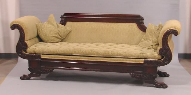 Appraisal: Straight crest rail with carved cornucopia ends molded base with