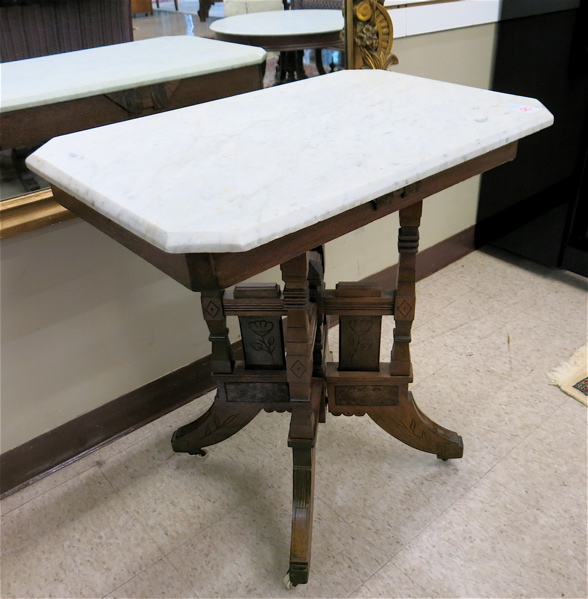 Appraisal: A VICTORIAN MARBLE-TOP LAMP TABLE Eastlake design American c the