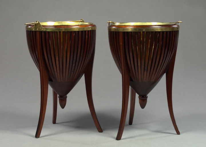 Appraisal: Pair of English Tripodal Brass-Mounted Mahogany-Staved Jardinieres in the Regency