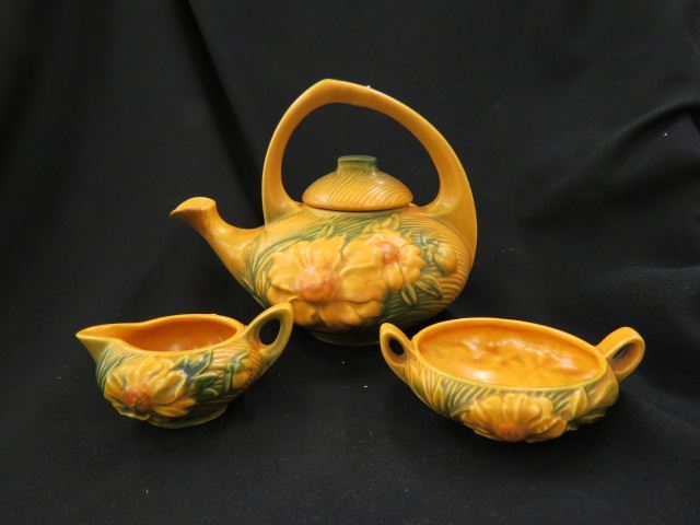 Appraisal: Roseville Pottery Peony Tea Set brown teapot is 's excellent