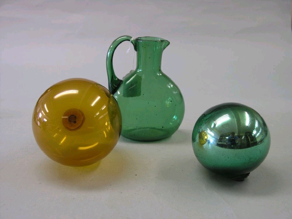 Appraisal: A green soda glass jug in and two glass witches'