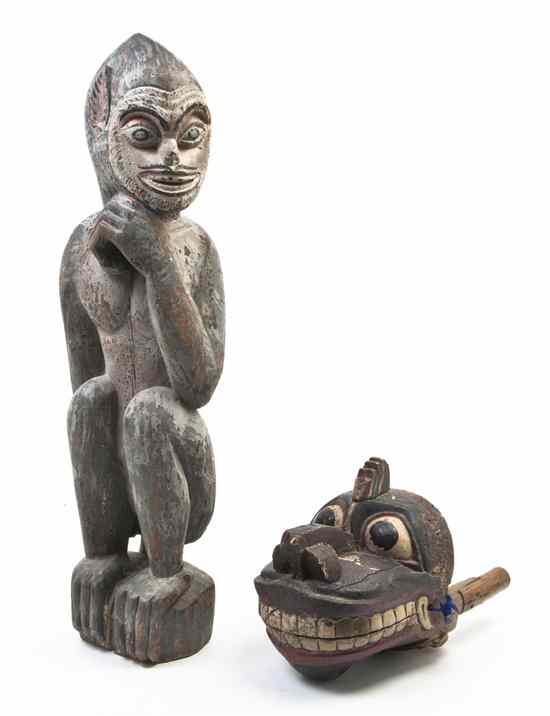 Appraisal: A Southeast Asian Carved and Painted Figure depicting a seated