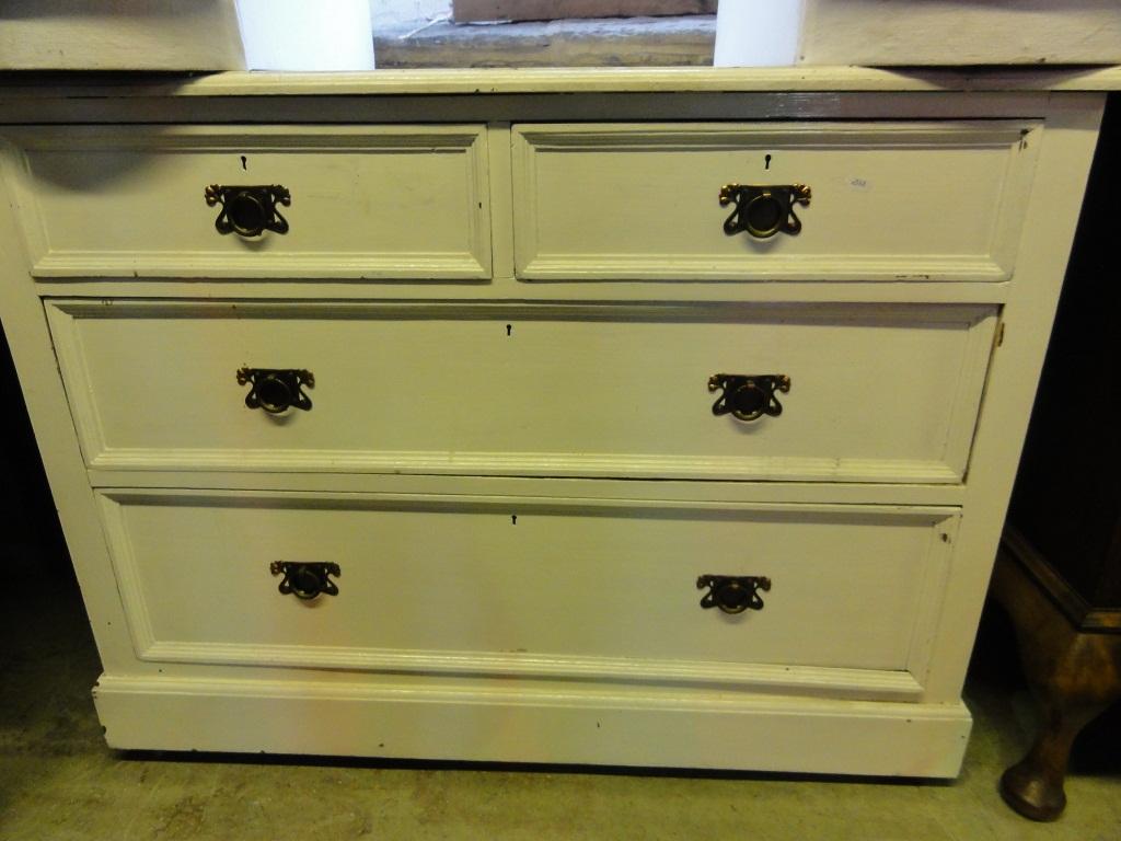 Appraisal: An Edwardian oak dressing chest fitted with two long and