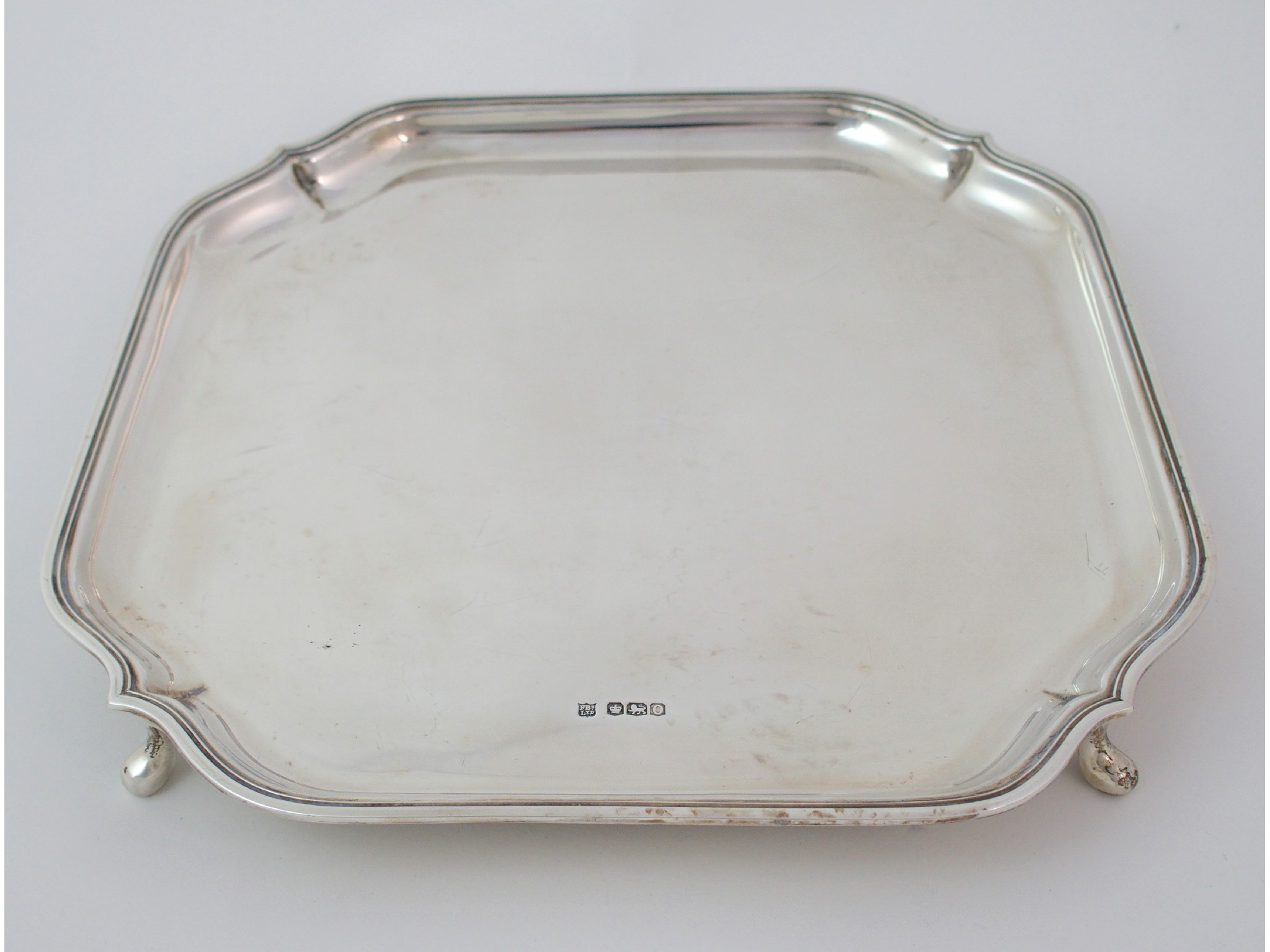 Appraisal: A silver salverby Fenton Brothers Limited Sheffield of square form