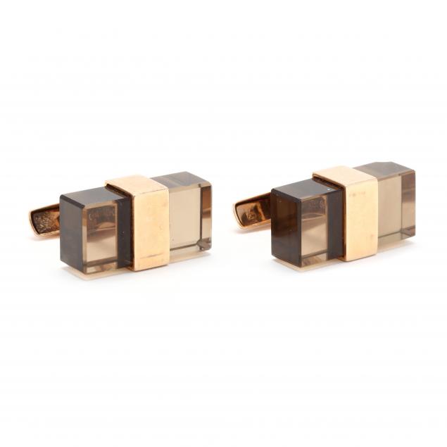 Appraisal: MODERNIST GOLD AND SMOKY QUARTZ CUFFLINKS FINLAND Designed with rectangular