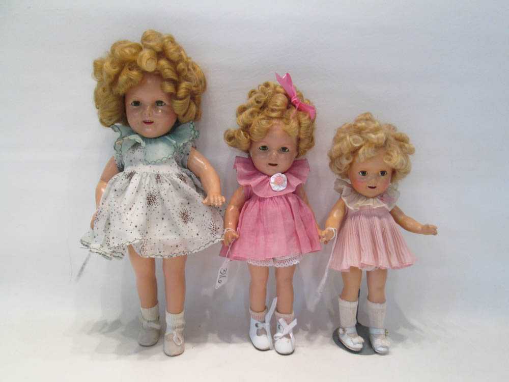 Appraisal: THREE COMPOSITION SHIRLEY TEMPLE DOLLS by Ideal with period clothing