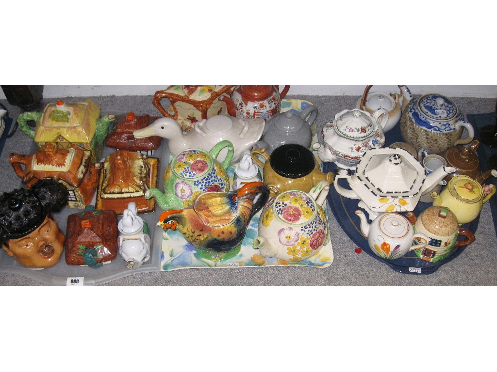 Appraisal: Lot comprising three trays of assorted ceramic novelty teapots