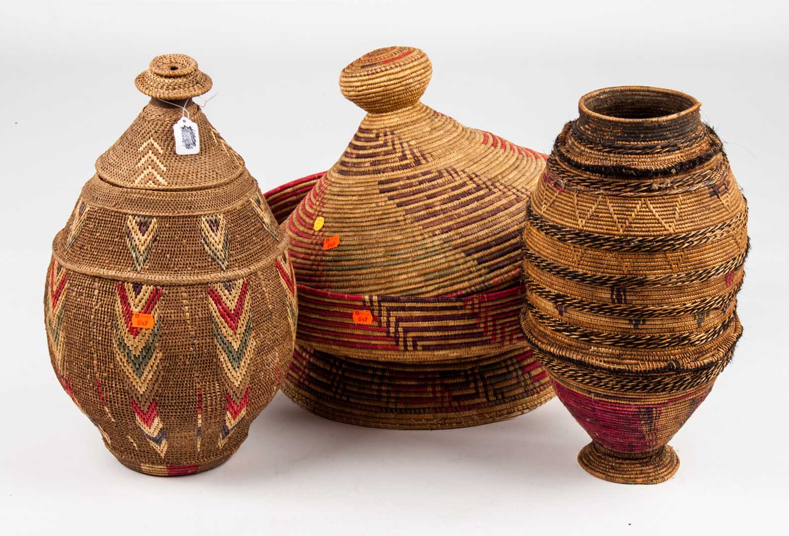 Appraisal: Three large covered baskets from Ethiopia