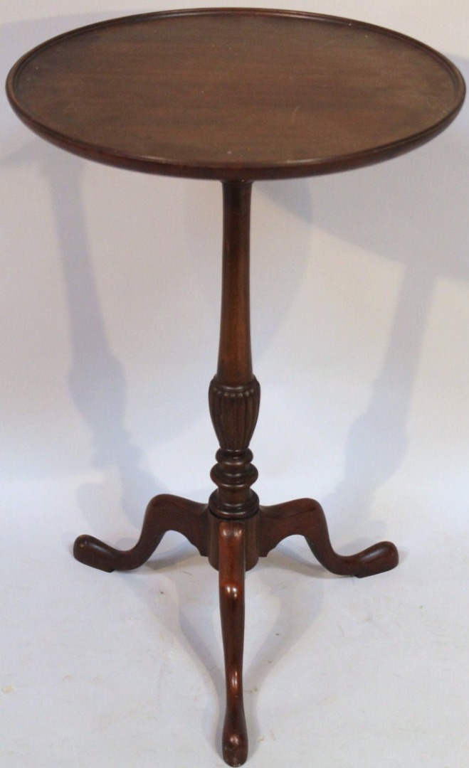 Appraisal: A tripod wine table the one piece mahogany top with