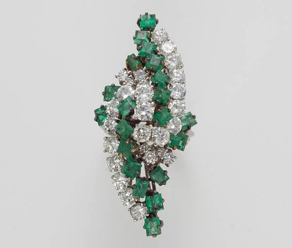 Appraisal: An emerald and diamond cluster ring estimated total diamond weight