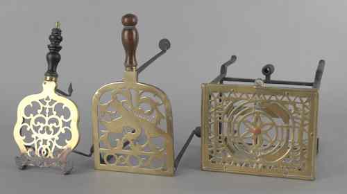 Appraisal: Three brass and iron trivets