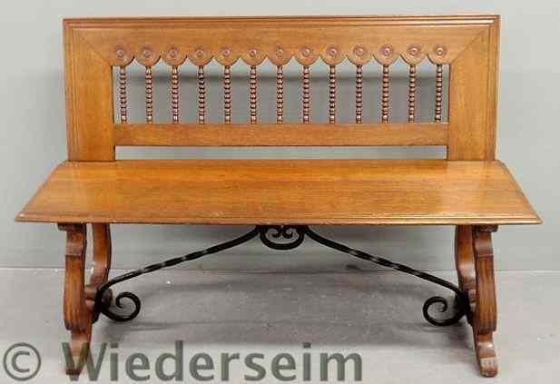 Appraisal: Italian walnut bench with spool carved back and wrought iron