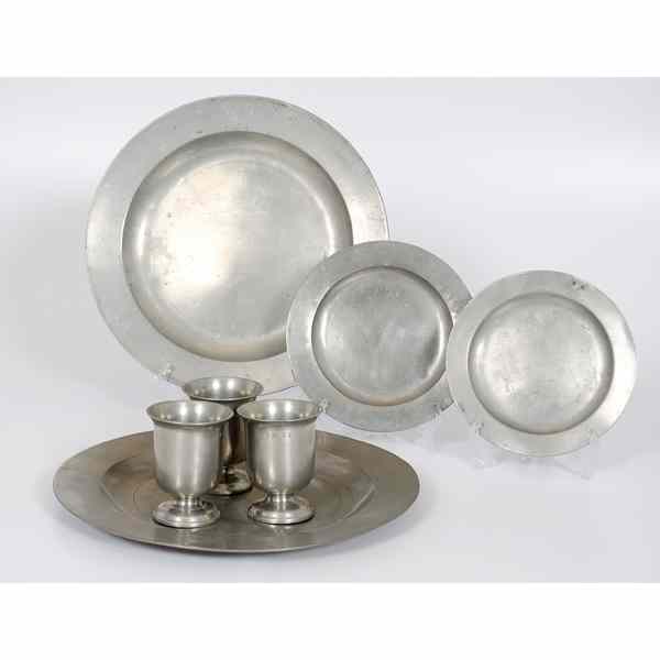 Appraisal: English Pewter Servers Plates and Beakers British th century Assembled