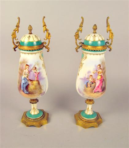 Appraisal: Pair of Sevres style gilt metal mounted covered urnslate th