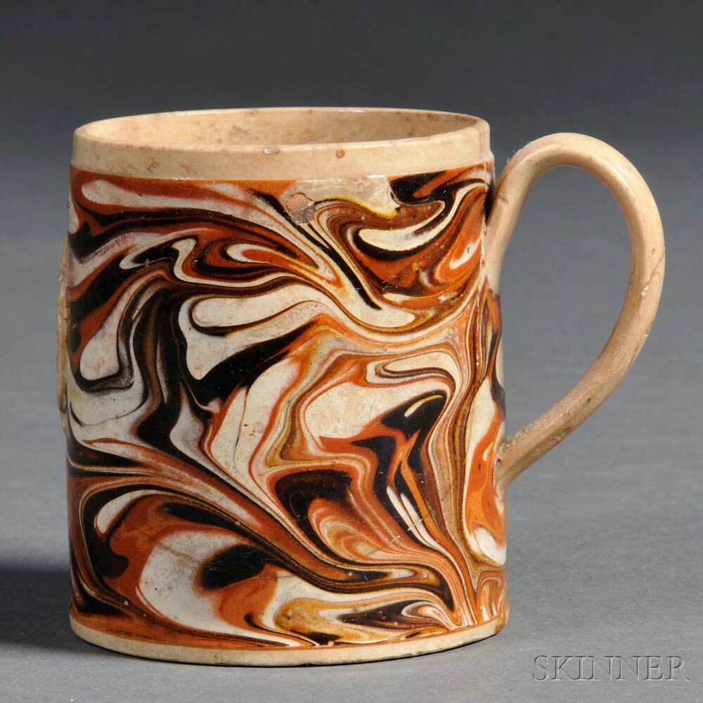 Appraisal: Small Marbled Mochaware Mug with Sprig-mold Portrait Medallion Britain early