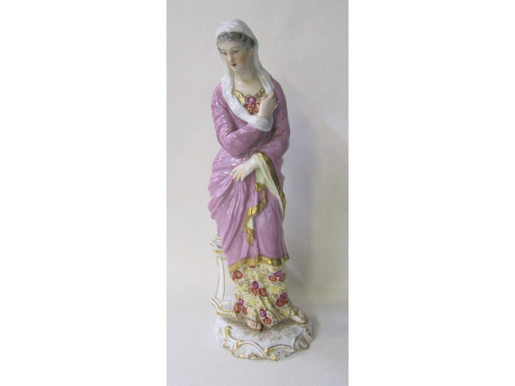 Appraisal: Continental porcelain figure of a woman wearing puce coloured cloak