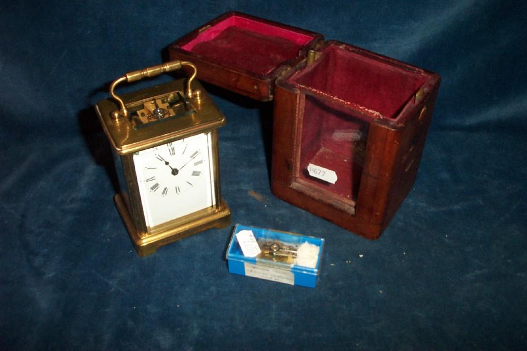 Appraisal: A brass carriage clock with loop handle and enamel dial