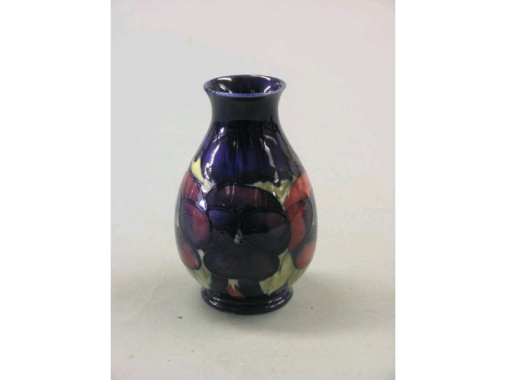 Appraisal: A small Moorcroft posy vase 'Pansy' pear shape painted against