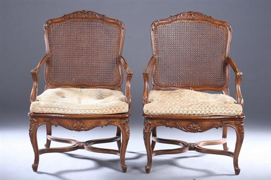 Appraisal: PAIR REGENCE STYLE FRUITWOOD FAUTEUILS th century with caned seat