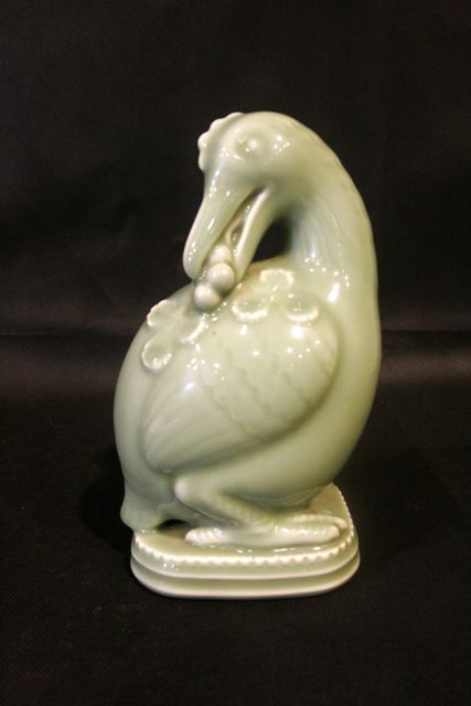 Appraisal: A Royal Copenhagen celadon glaze figure of a bird by