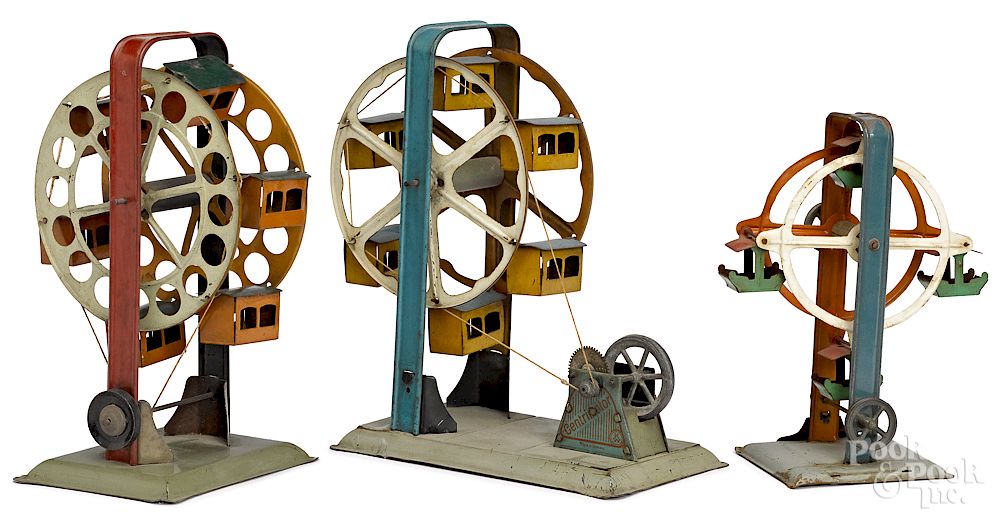 Appraisal: Three painted tin Ferris wheel steam toy accessories Three painted