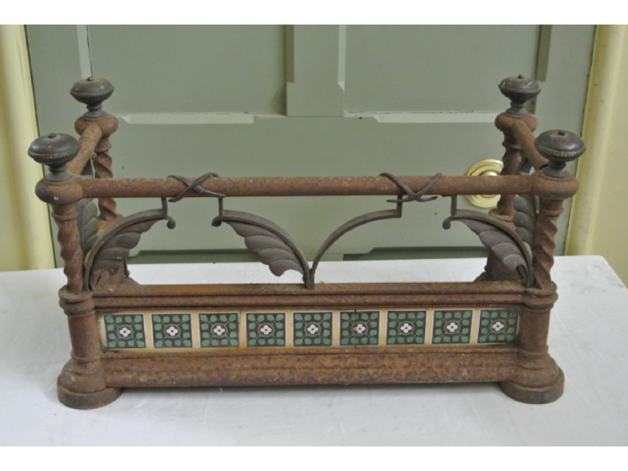 Appraisal: A Puginesque unusually small gothic revival cast iron framed fender