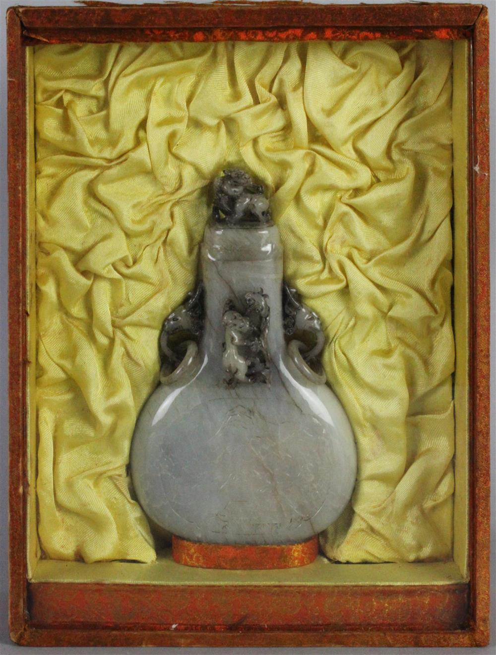 Appraisal: GREYISH WHITE STRIATED JADE BOTTLE IN SHADOW BOX of flattened