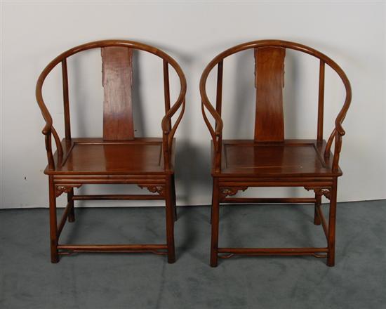 Appraisal: Pair of Chinese Horseshoe Continuous Arm Chairs each with a