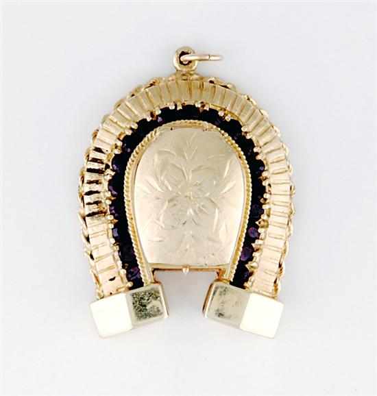 Appraisal: Gold and garnet horseshoe-form locket pendant lidded compartment surrounded by