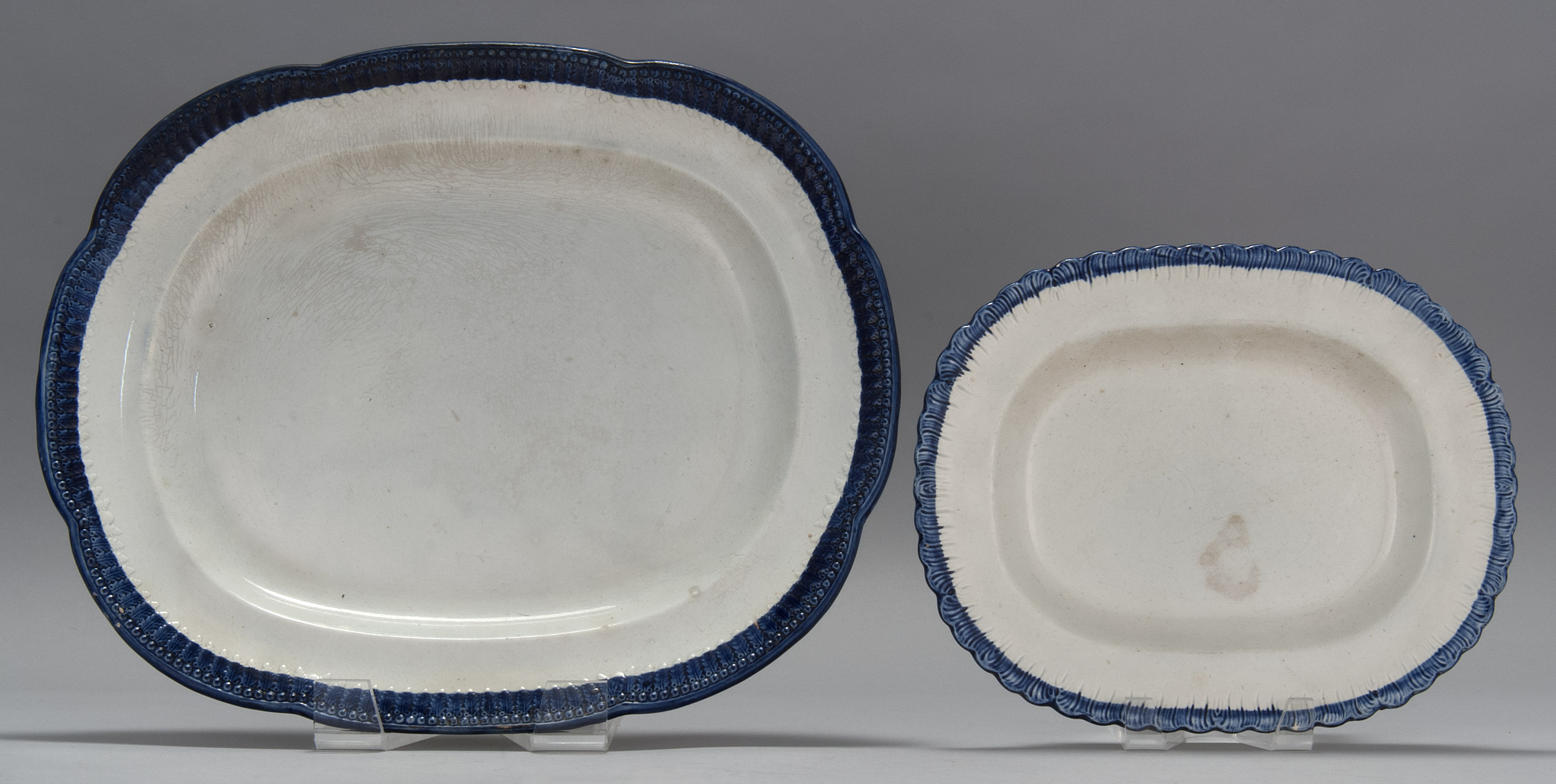 Appraisal: TWO ENGLISH SOFT-PASTE PLATTERS Early th CenturyEach with molded cobalt