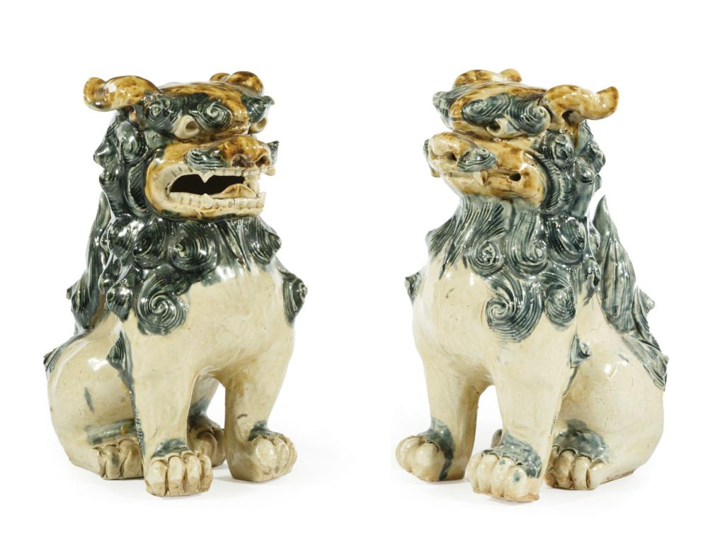 Appraisal: Pair of Chinese Glazed Stoneware Buddhist Lions Qing Dynasty -