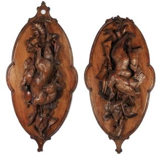 Appraisal: Carved Black Forest plaques th c Pair of oversized Black