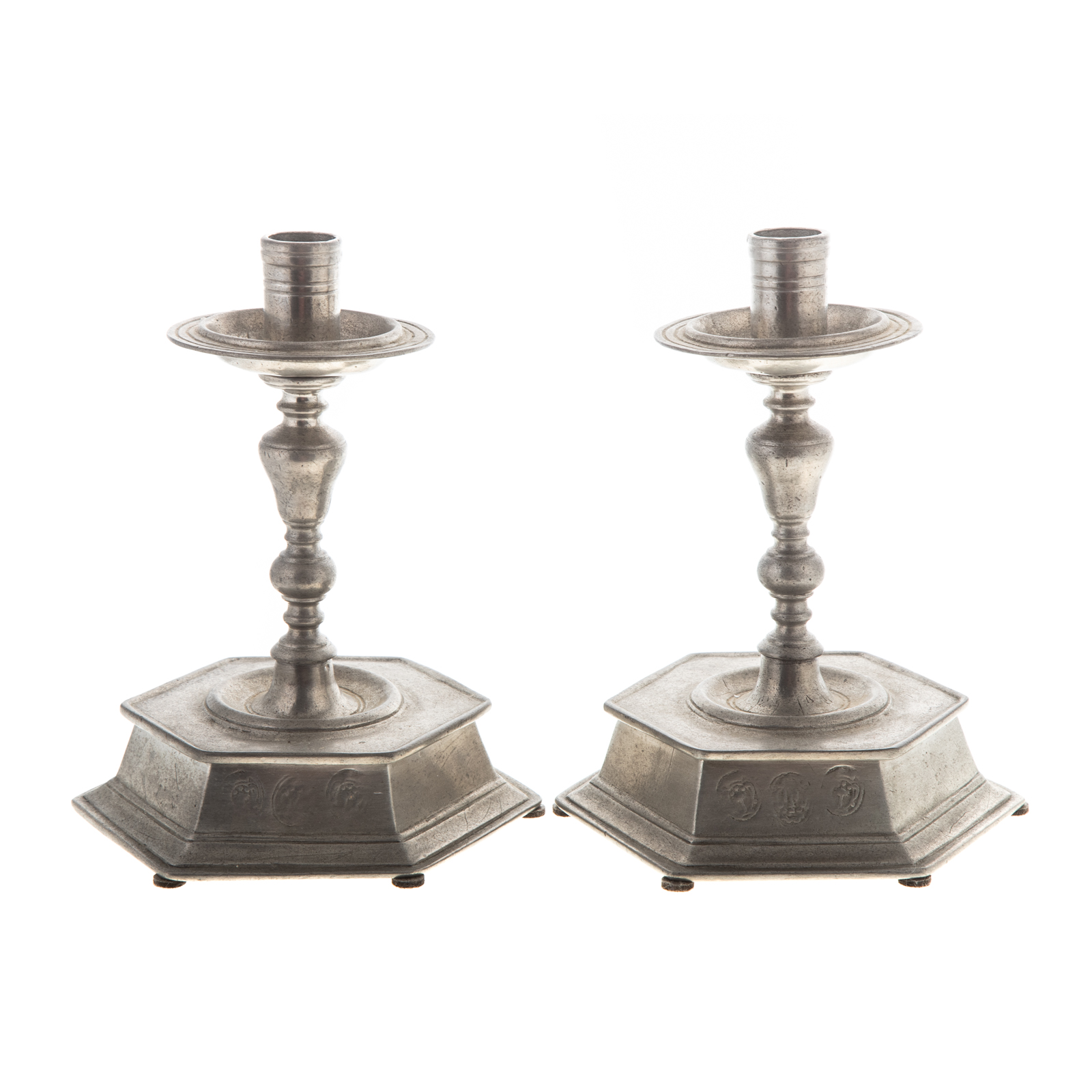 Appraisal: A PAIR OF CONTINENTAL PEWTER CANDLESTICKS th century raised hexagonal