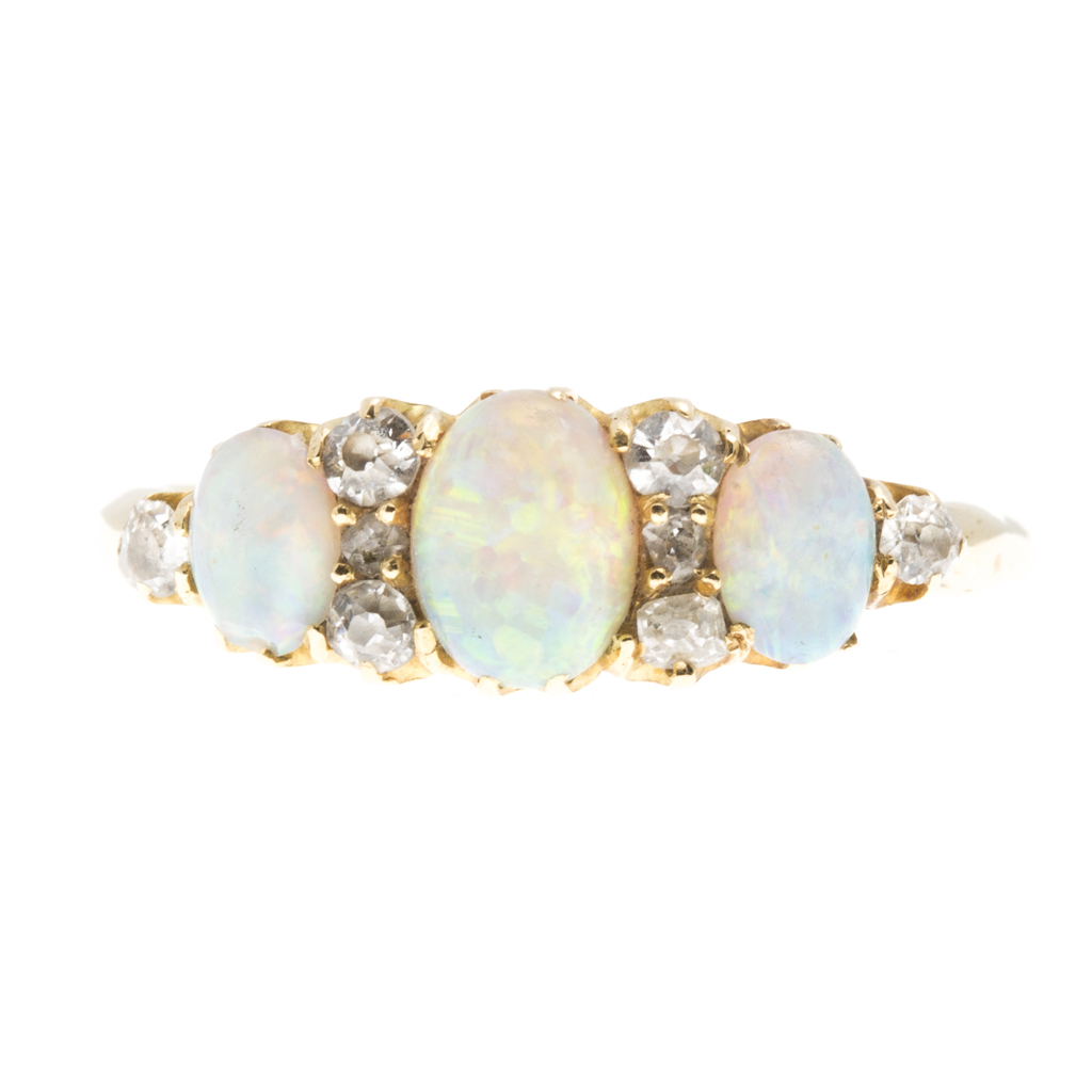 Appraisal: An opal and diamond set ring claw set with three