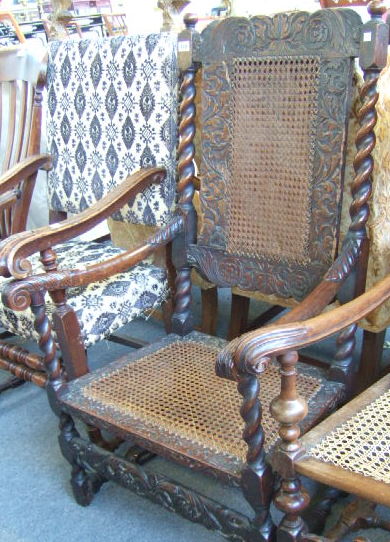 Appraisal: A Charles II walnut open armchair with all over carved