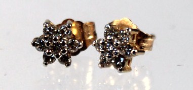 Appraisal: A pair of diamond cluster ear studs on yellow metal