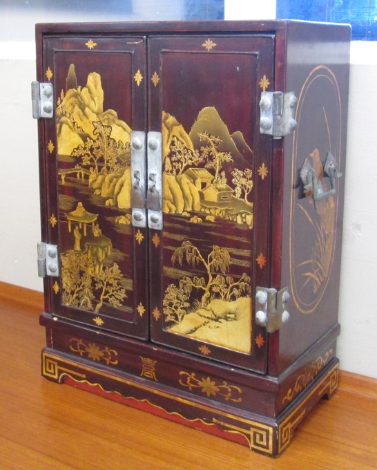 Appraisal: SMALL CHINESE WOOD CABINET the double doors decorated with gold